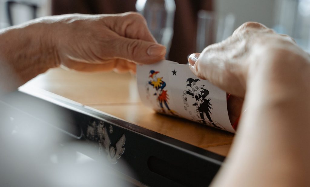 Woman holding cards in her hands